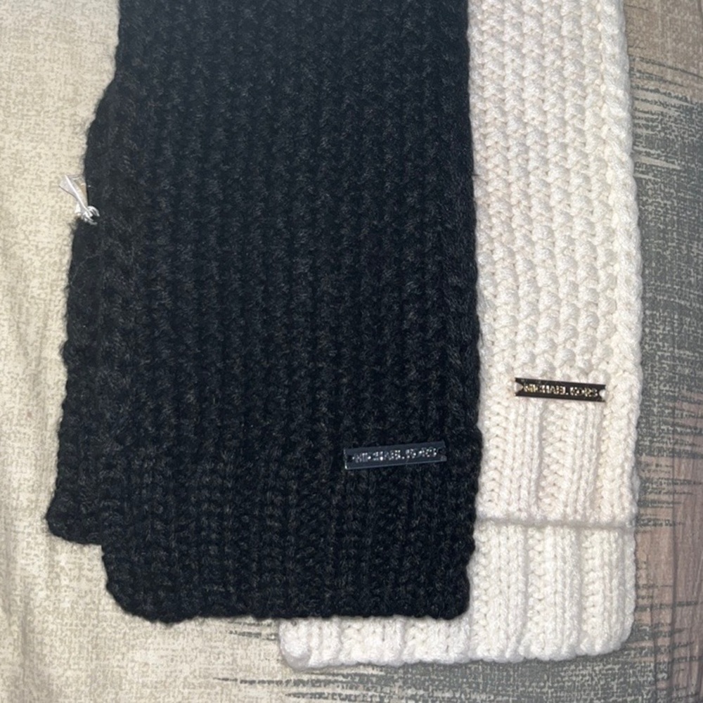 Two Michael kors scarfs in black and white.